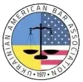 The logo for the american ukrainian bar association has a scale of justice on it.