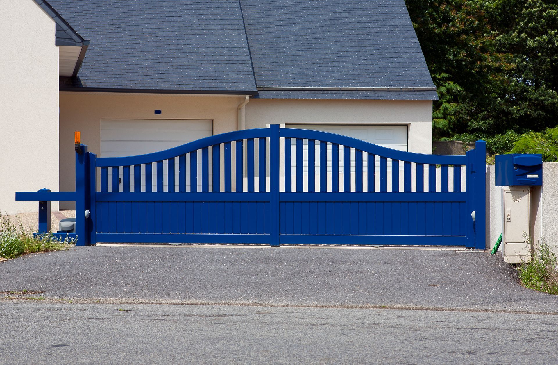 Residential driveway gate highlighting security and style, representing gate system installation.