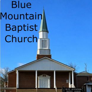 Blue Mountain Baptist Church exterior with steeple and blue sky.