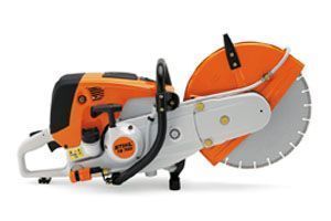 A stihl circular saw is sitting on a white surface.