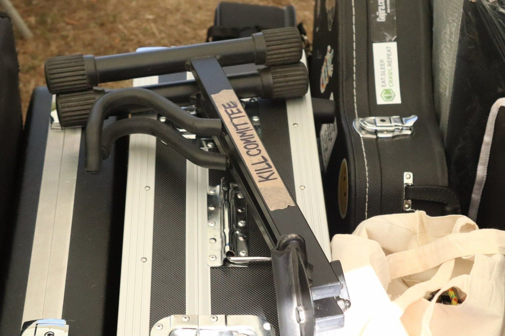 A guitar stand with the word killowatts on it