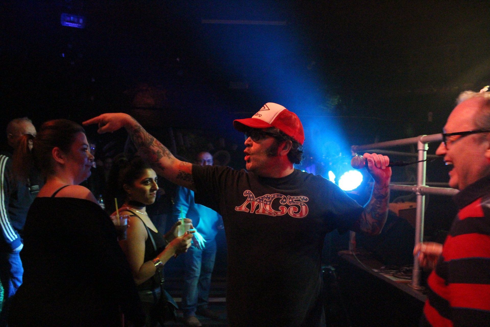 A man wearing a black shirt with the word rocket on it