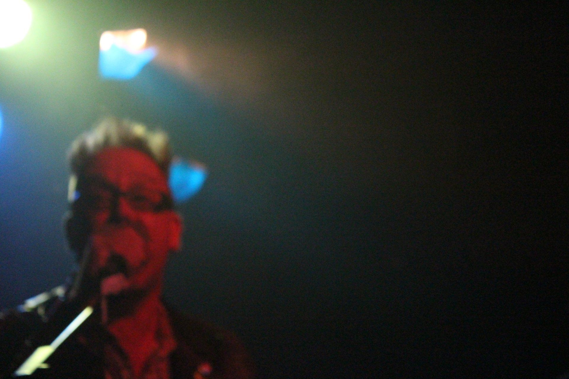 A blurry picture of a person in a dark room