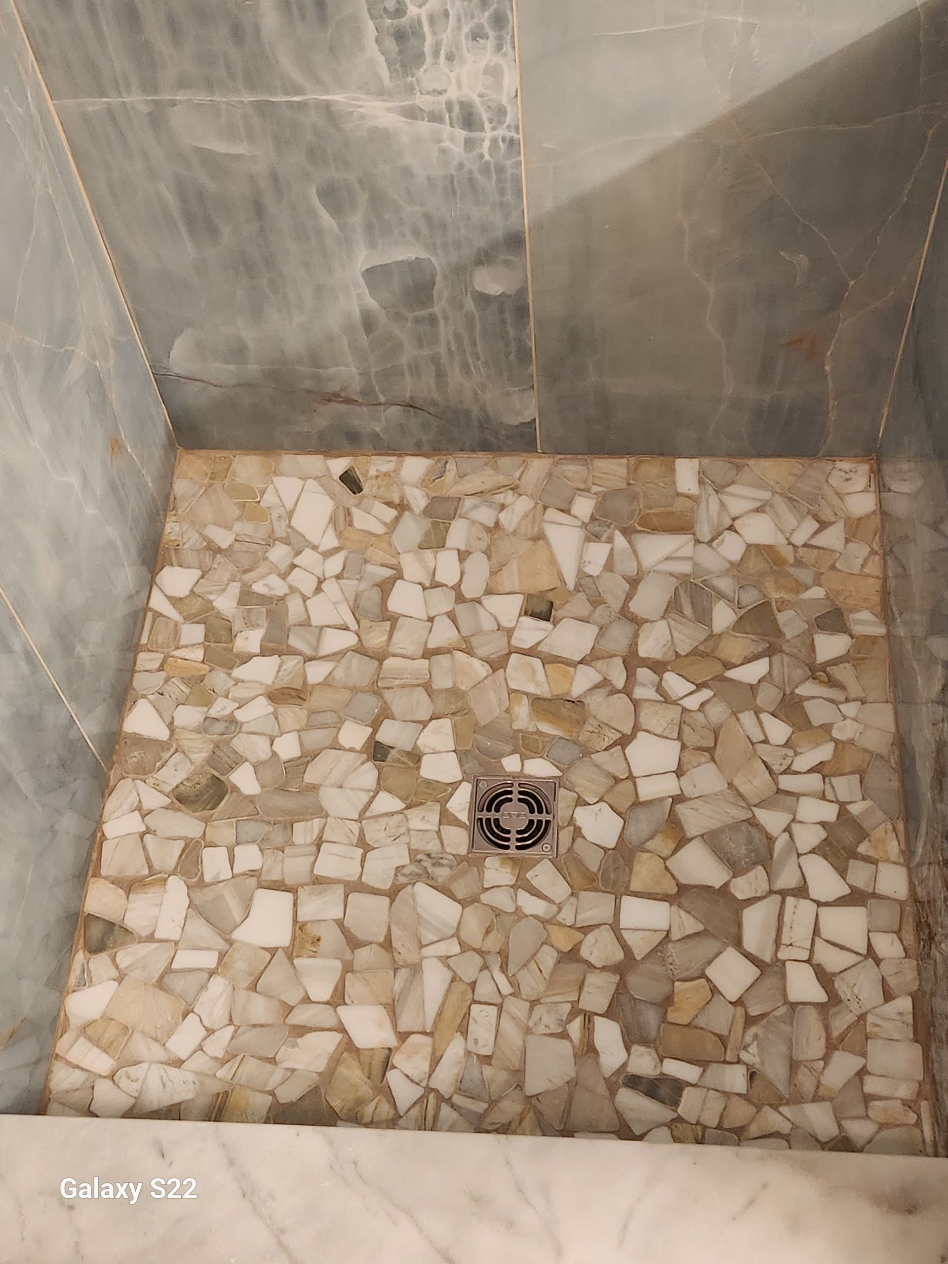 A man is setting up a tile.