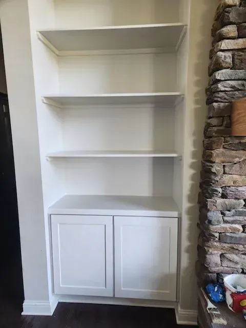 White Cabinet and Brick Wall