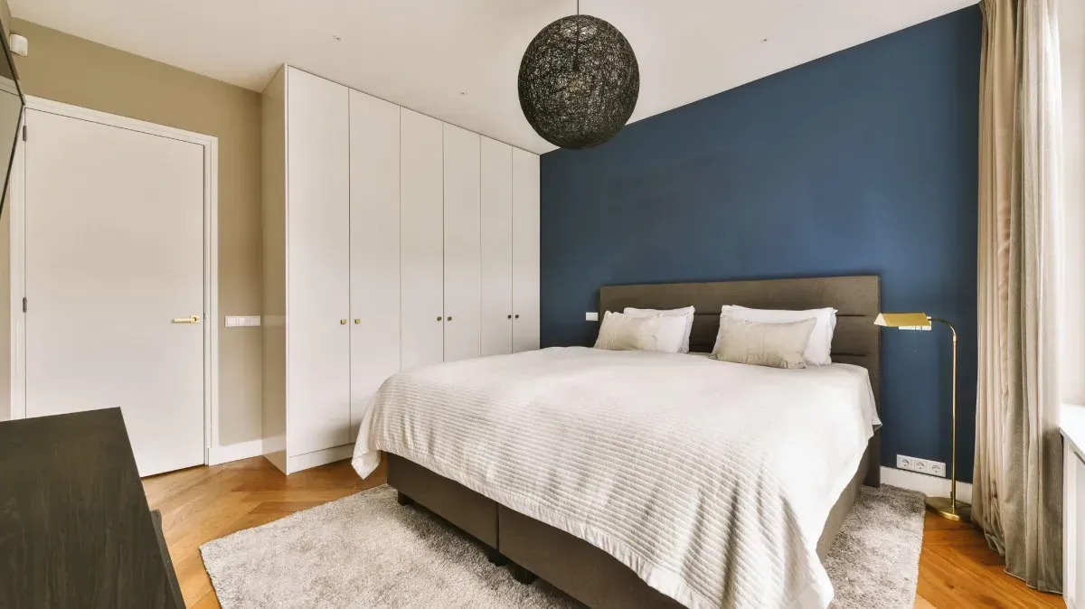 Custom accent wall with Board and Batten design in a modern bedroom, showcasing depth and texture.