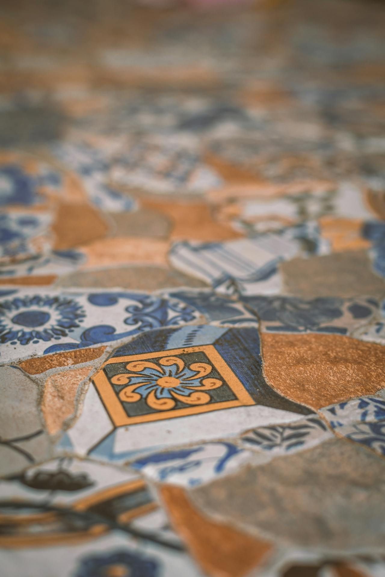 A close up of a colorful tile floor with a pattern.