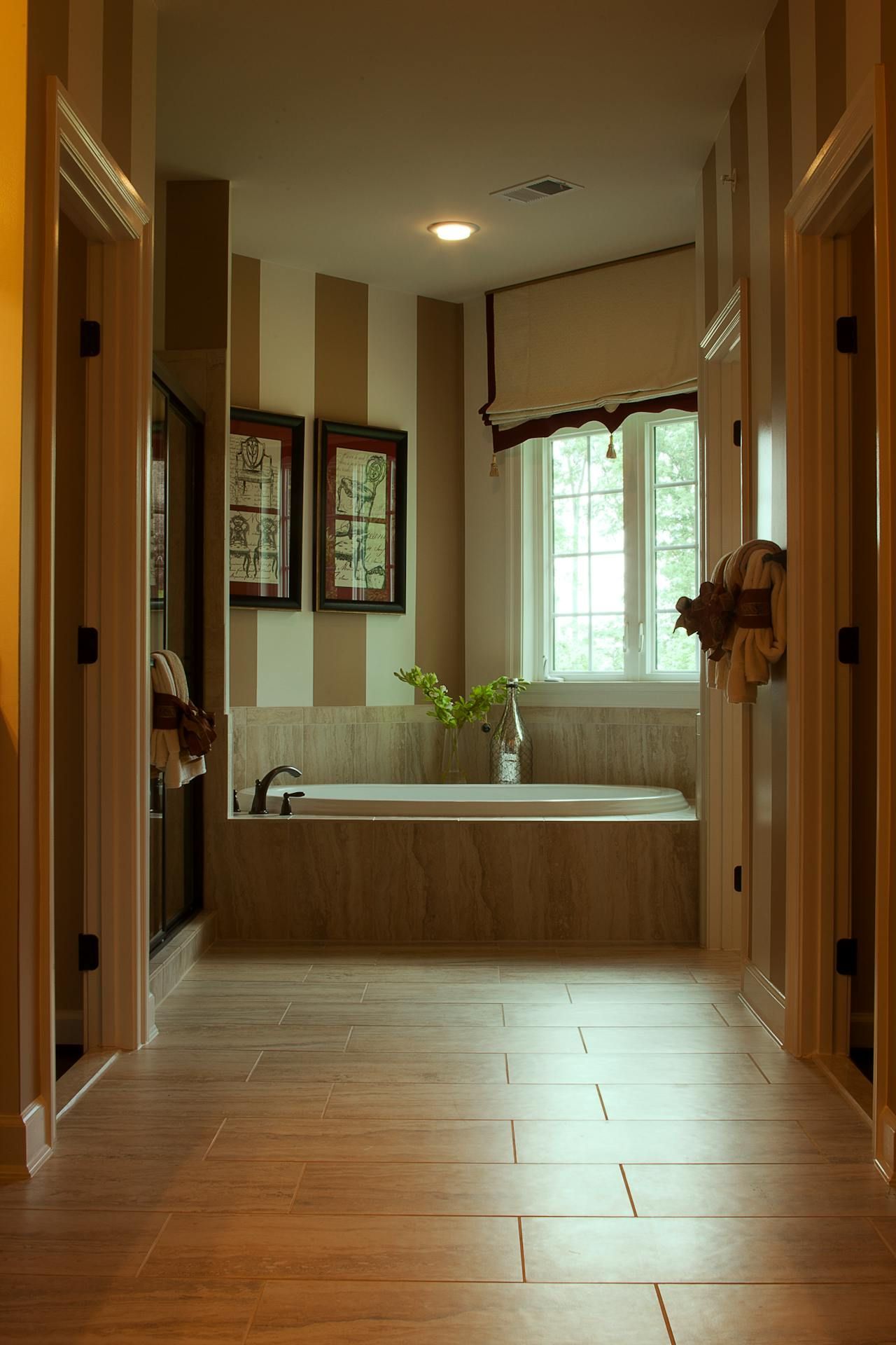 There is a bathtub in the middle of the bathroom.