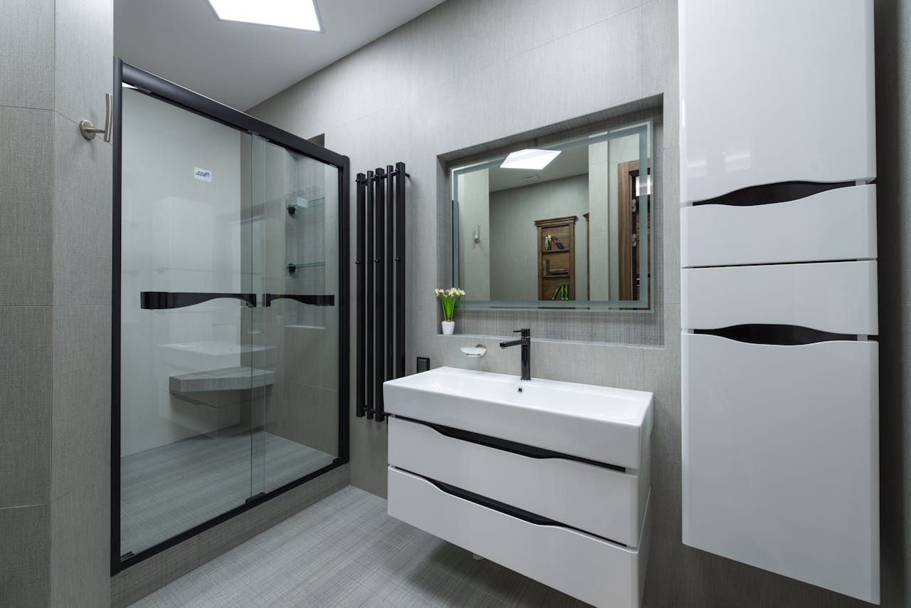 Modern bathroom featuring custom bathroom cabinets with sleek storage and high-quality cabinetry.