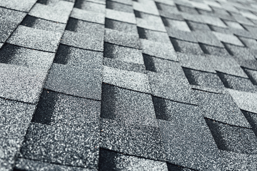 A close up of a roof with shingles on it.