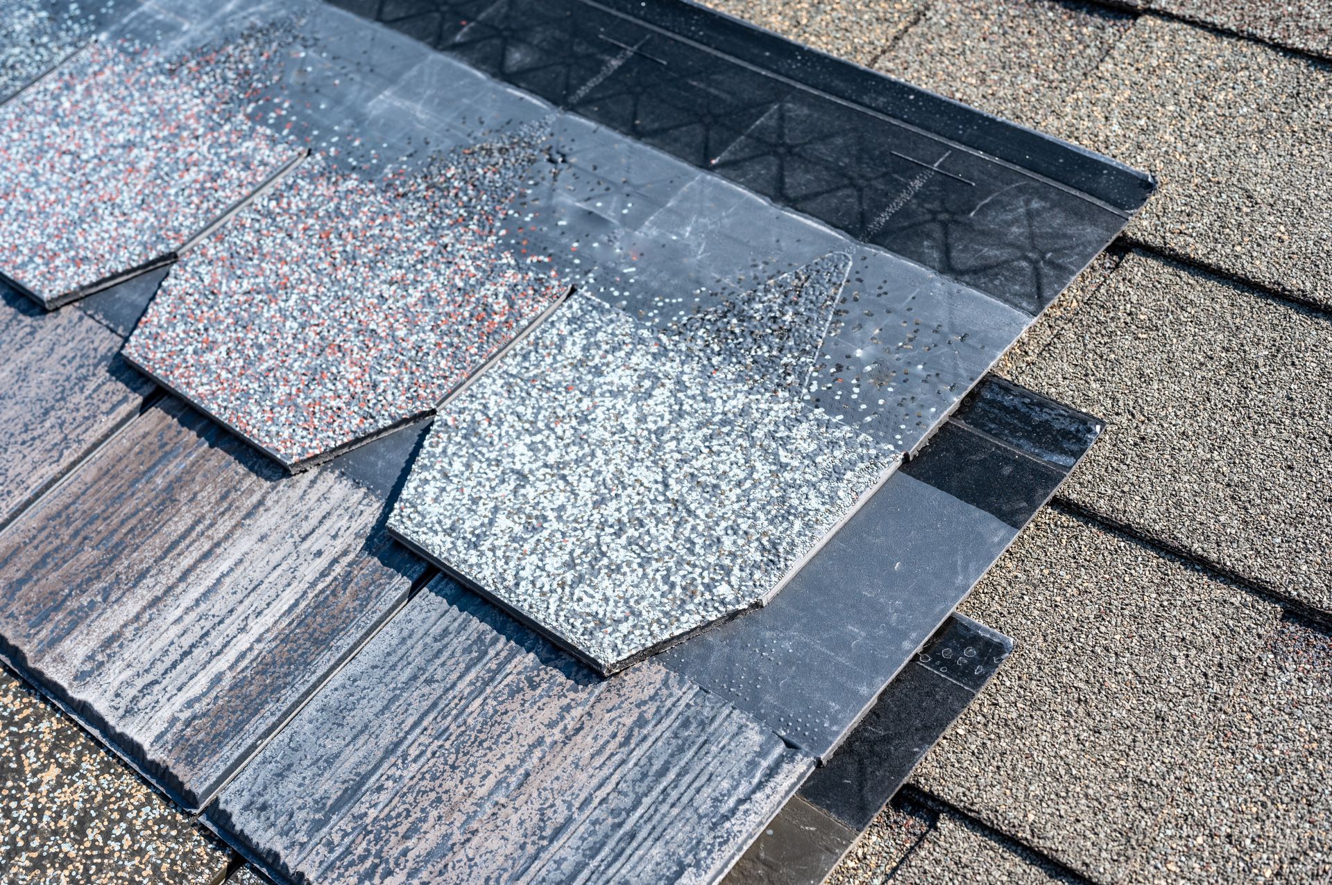 A close up of a roof with shingles on it.