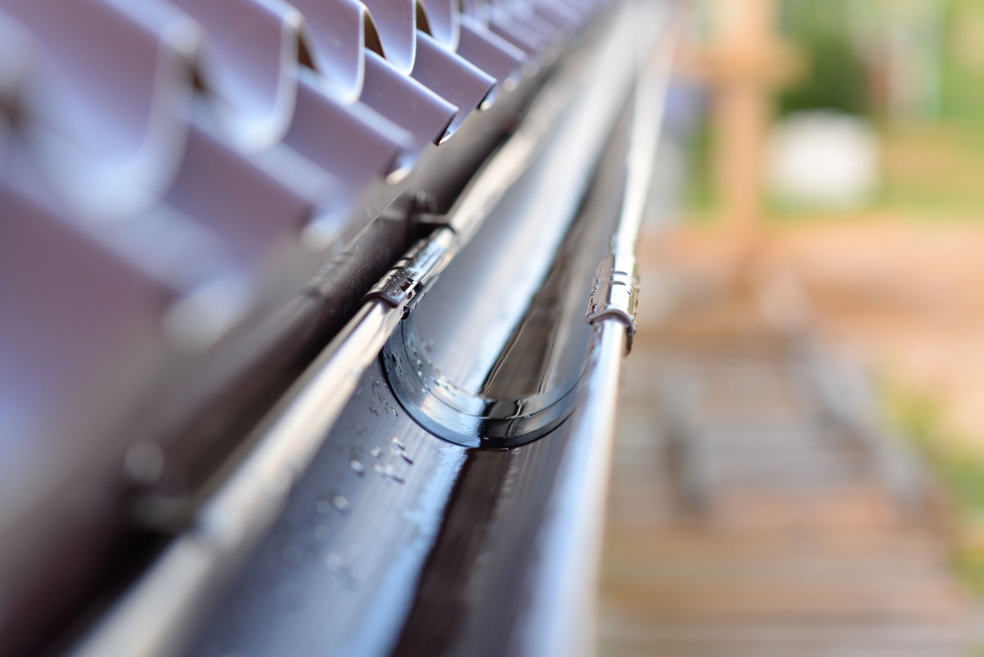 A close up of a gutter on a roof.