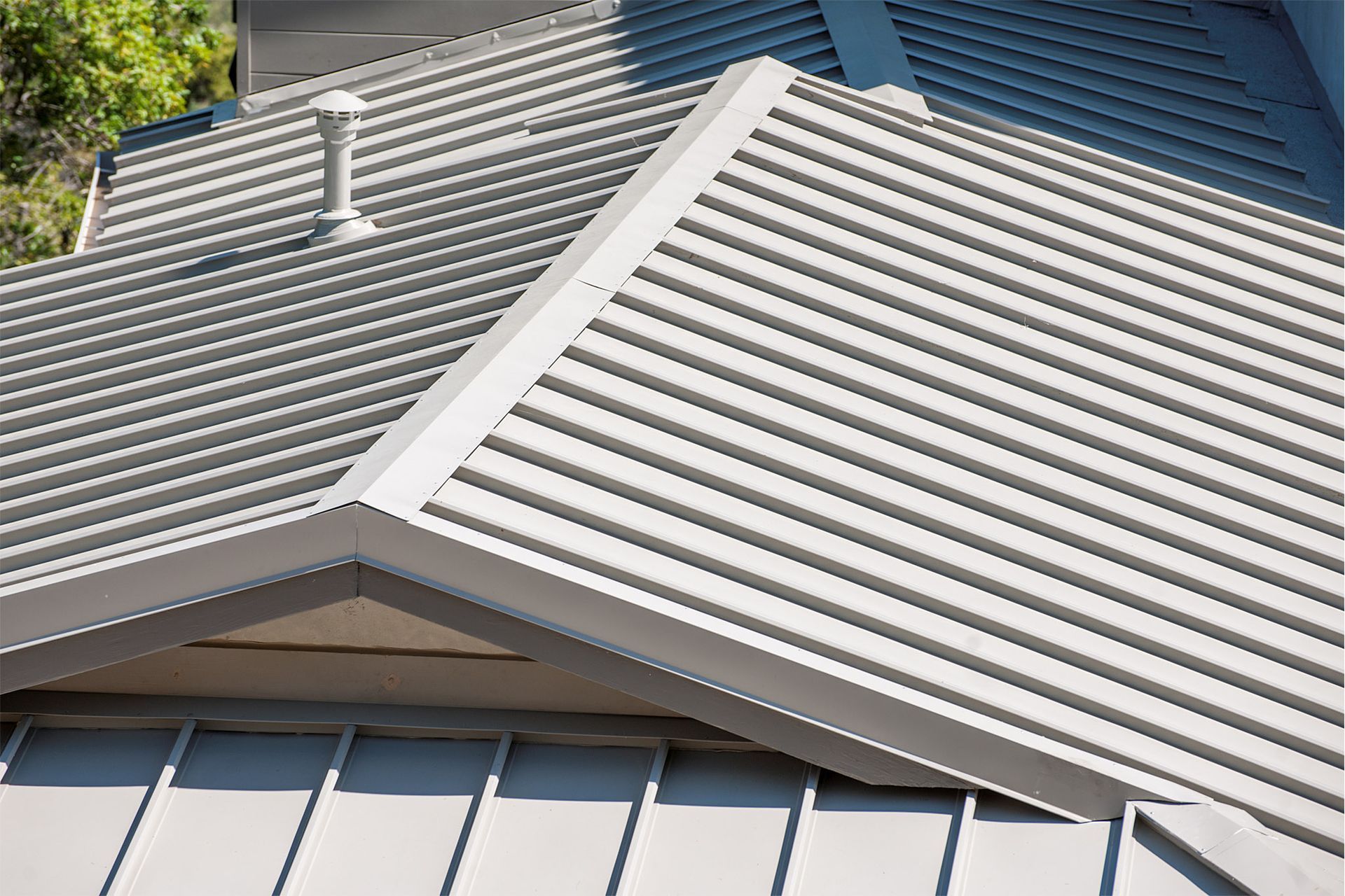 A close up of a metal roof on a house.