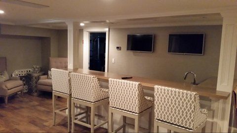 A large house is being built in a residential area.