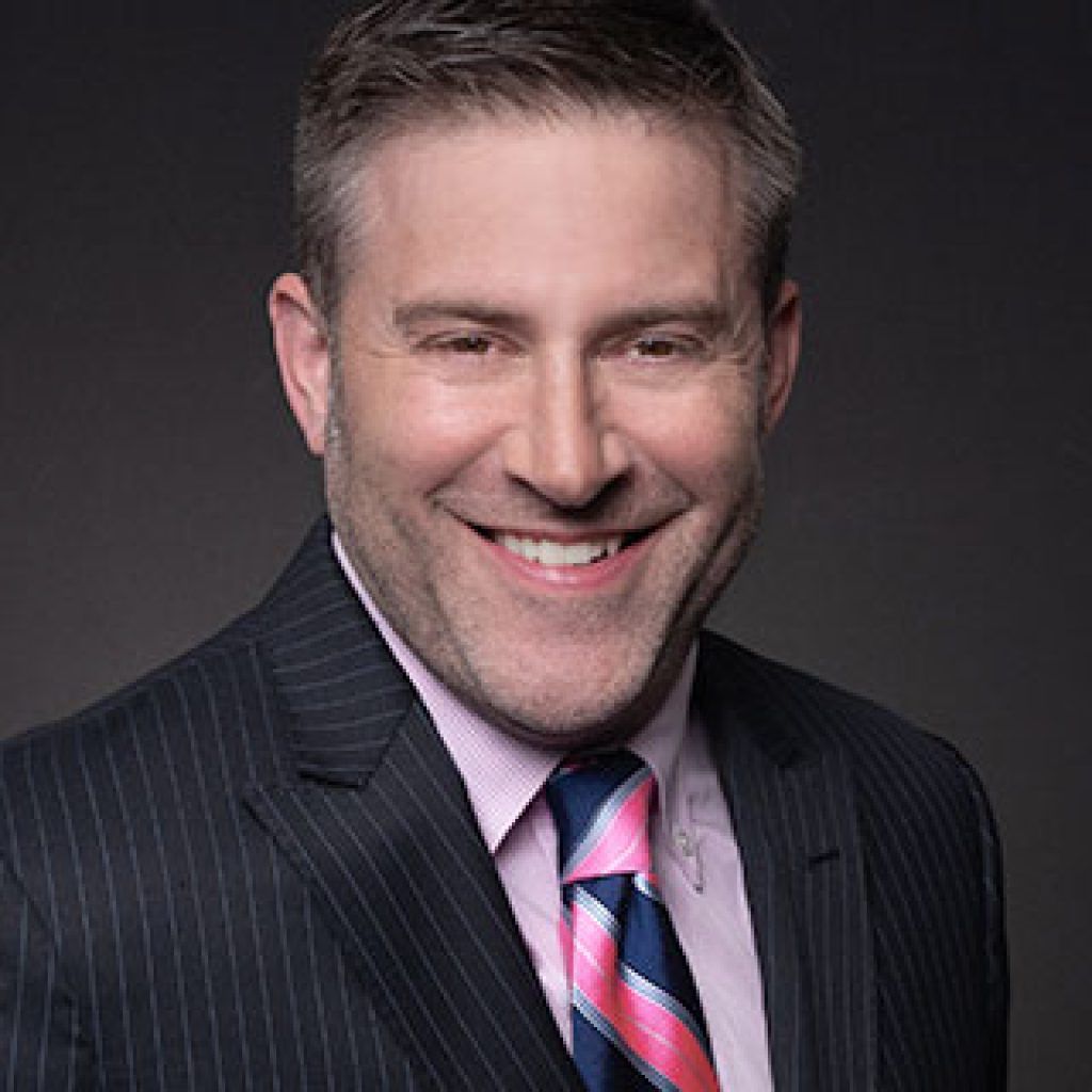 A large building with balconies and hanging potted plants