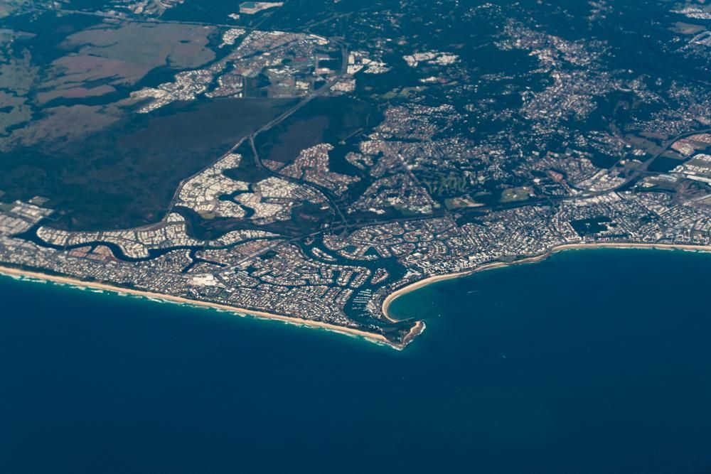 An Aerial View of a City Next to a Body of Water — IBS Skip Bins in Minyama, QLD