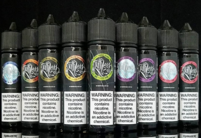 Rows of vape juice bottles with black labels and warning labels.