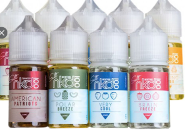 Bottles of NKD 100 vape juice, featuring various flavors like American Patriots, Polar Breeze, and Very Cool.