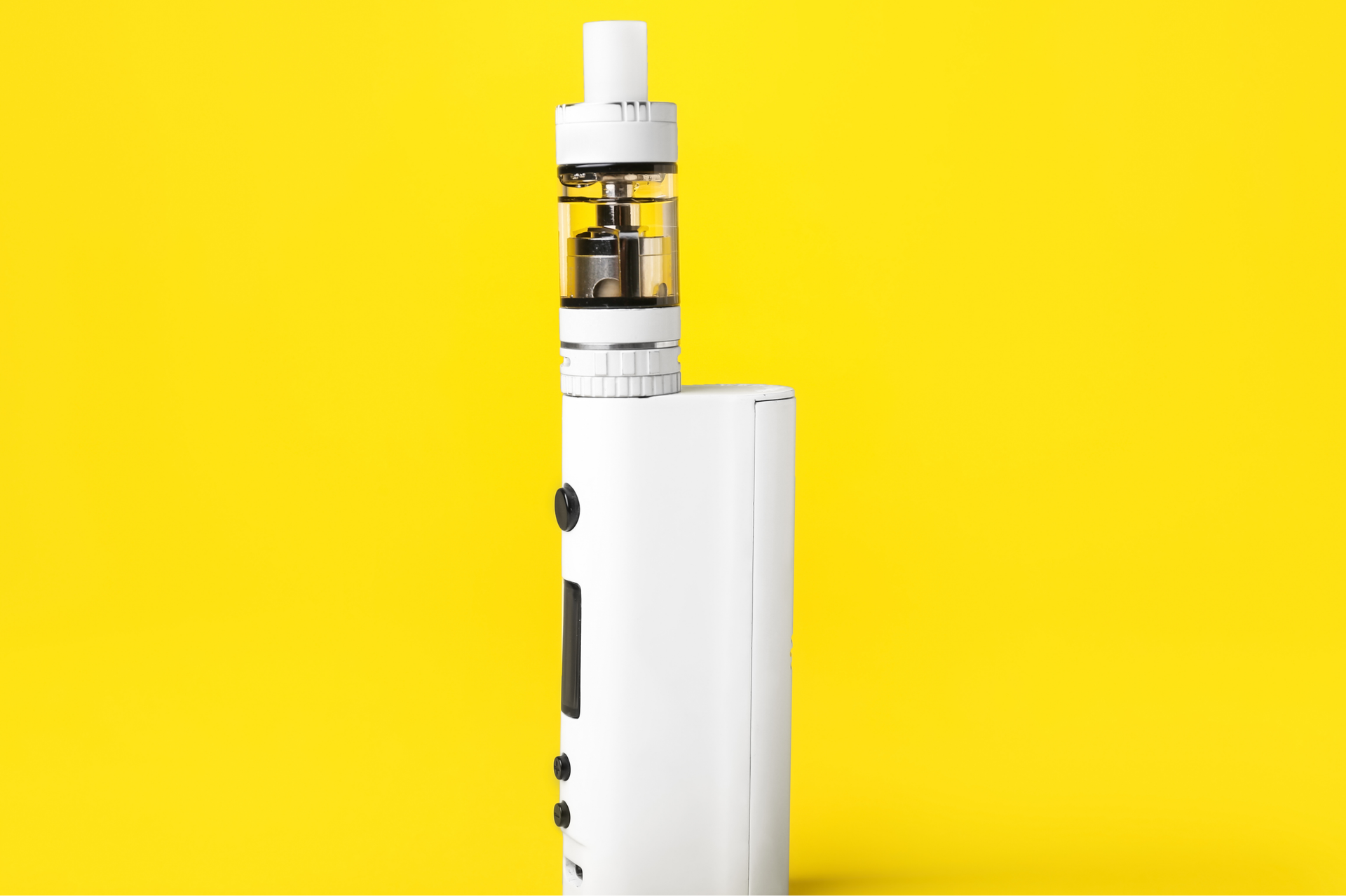 White vape device on a yellow background.