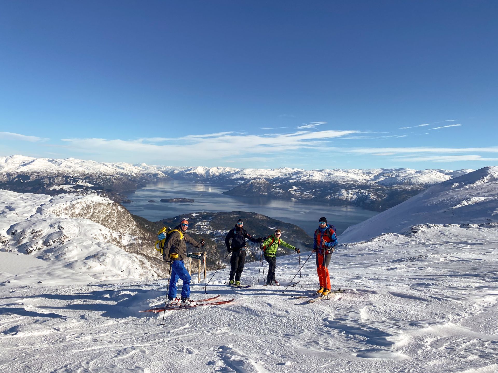 People on a ski touring trip with panoramic fjord views