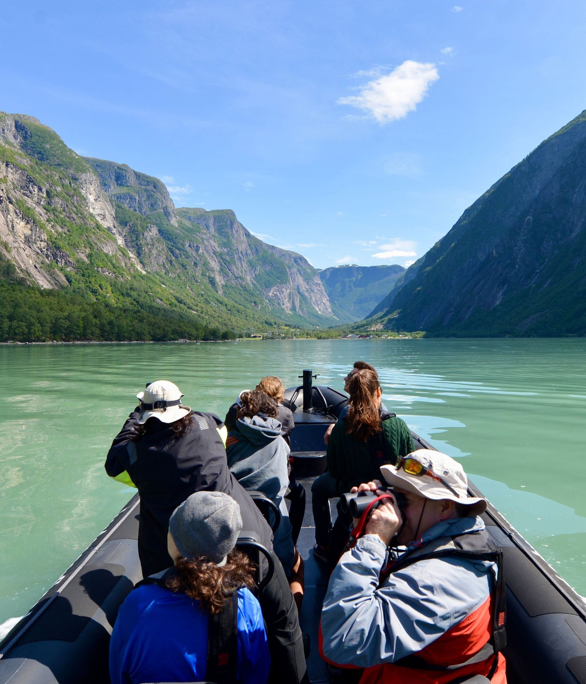 Hikers on a viewpoint in Fykseund - Hardangerfjord