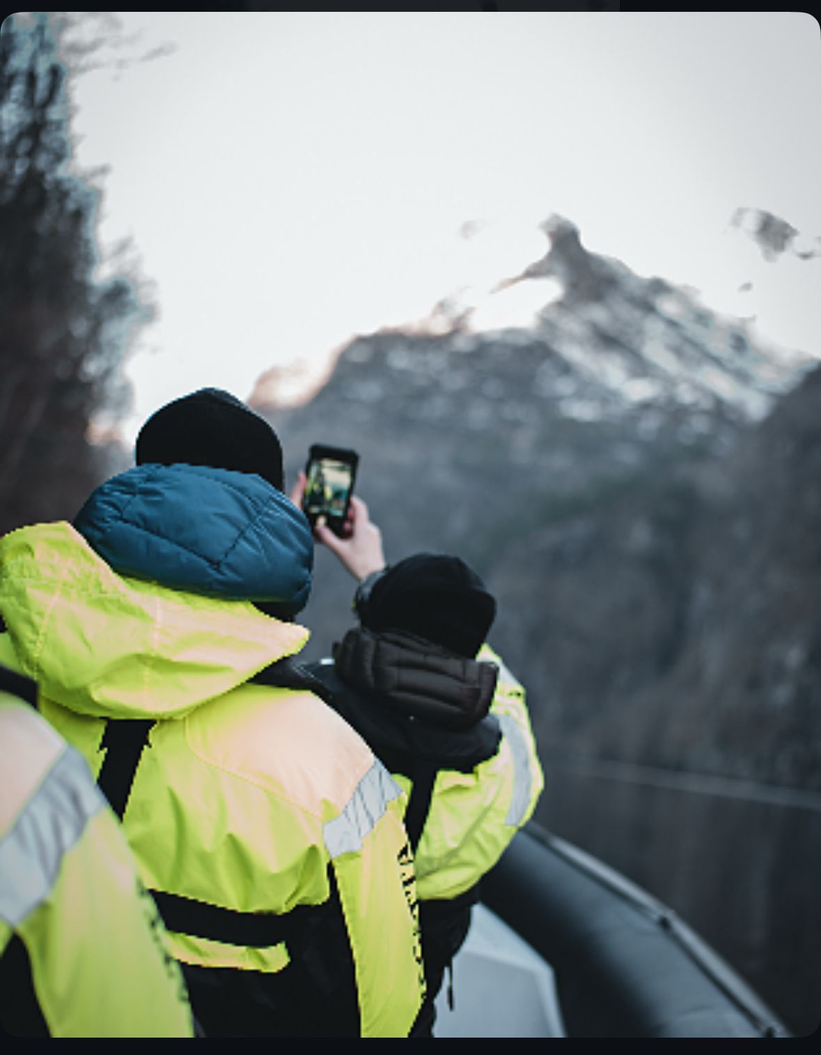 People taking pictures on a Hardangerfjord winter RIB safari