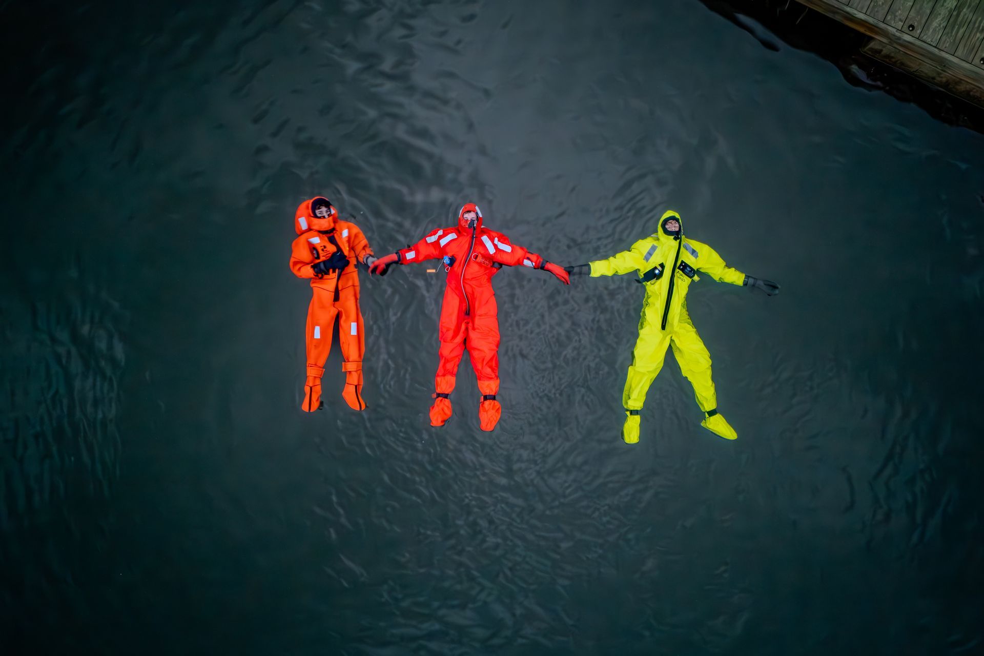 People floating in the fjord on a peaceful winter day