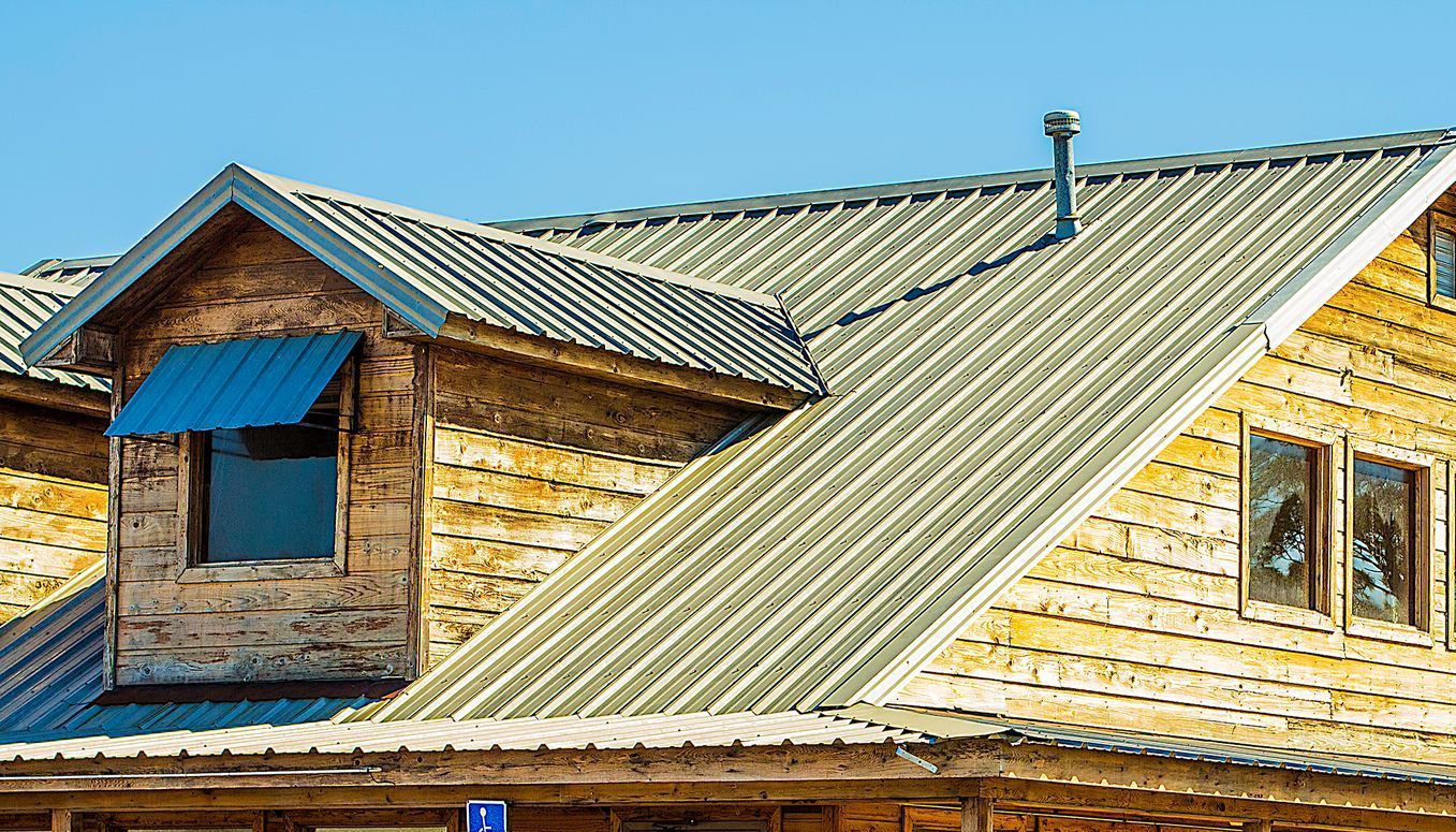 A group of people are working on the roof of a building.