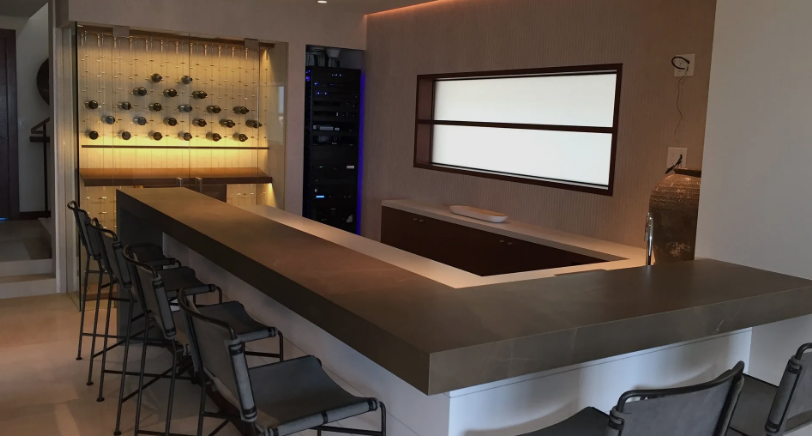 A red sports car is parked in a garage.