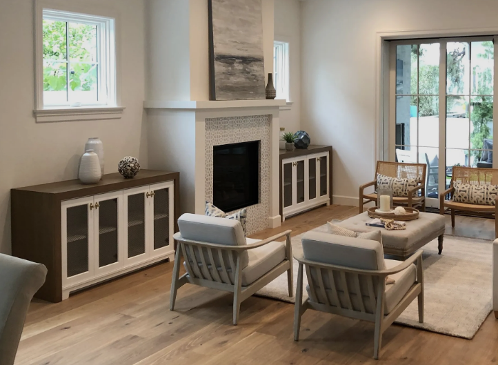 A black sports car is parked in a garage.