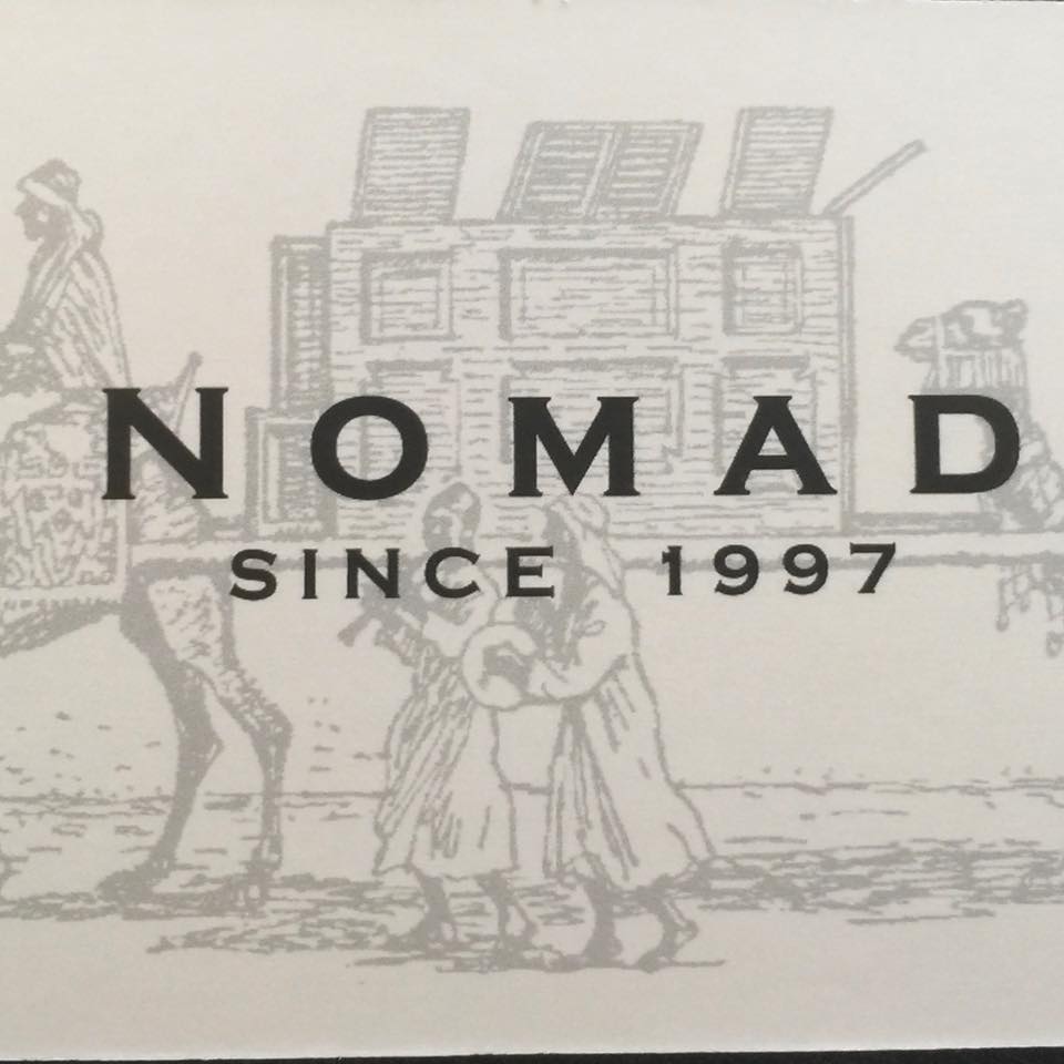 Man Holding A Package — Newton, WI — Nomad Moving Services Man Holding A Package — Newton, WI — Nomad Moving Services