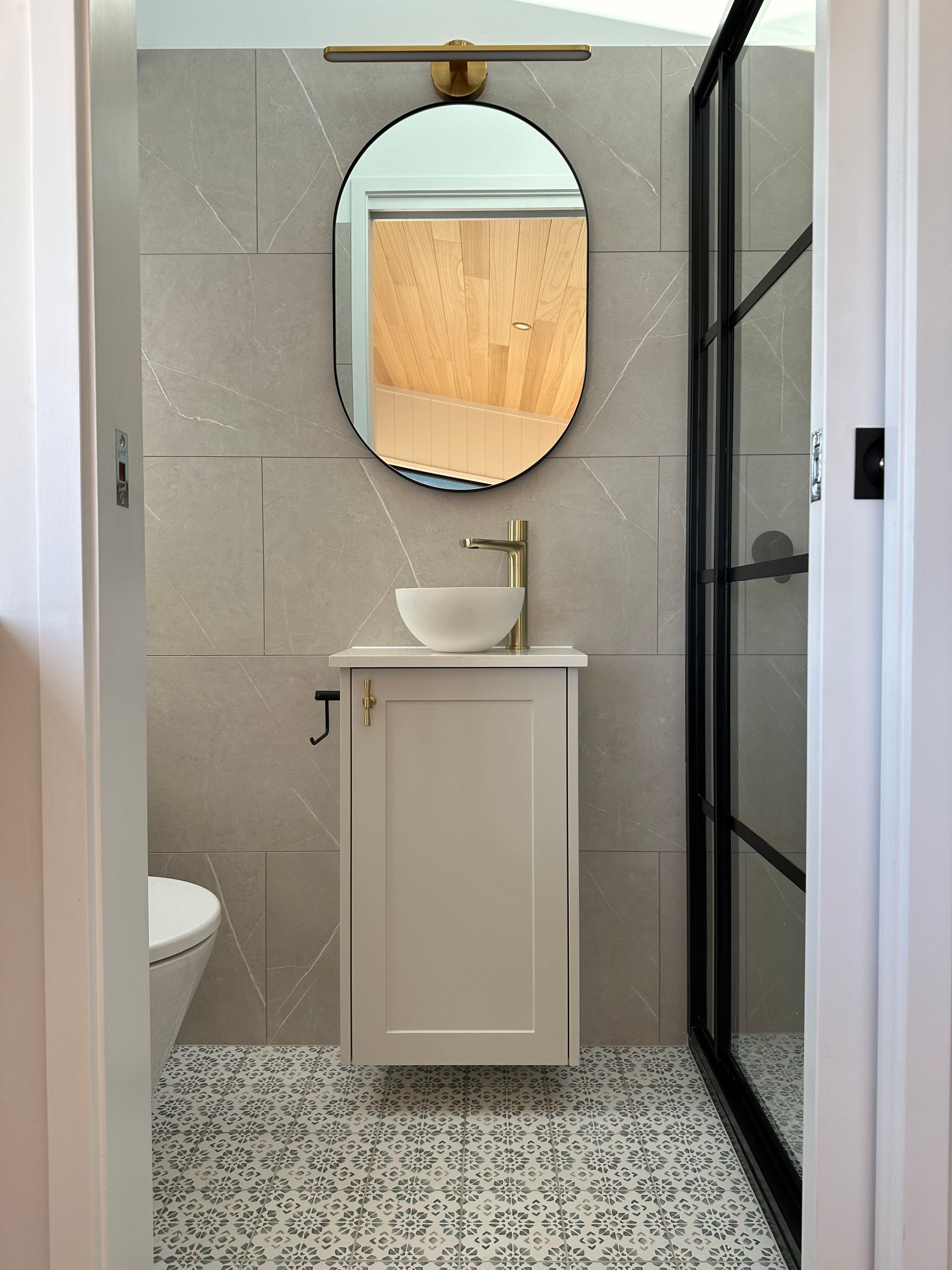 A Bathroom With a Sink , Toilet and Mirror — Highlands Tiny Homes In Braemar, NSW