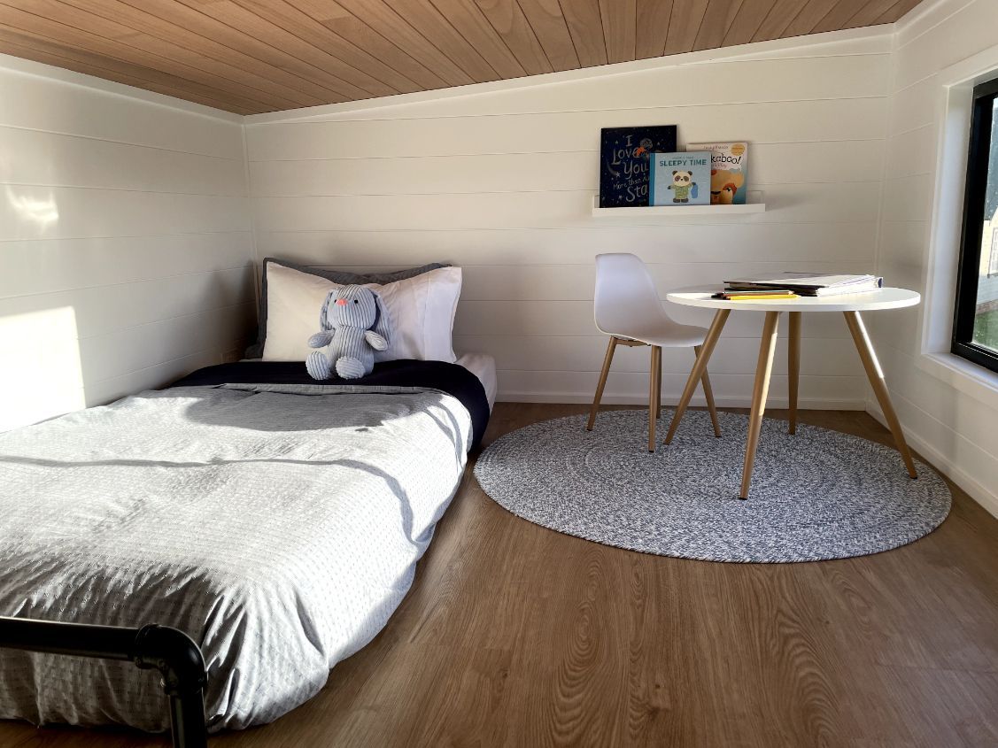 There Is a Bed and A Desk in The Room — Highlands Tiny Homes In Braemar, NSW