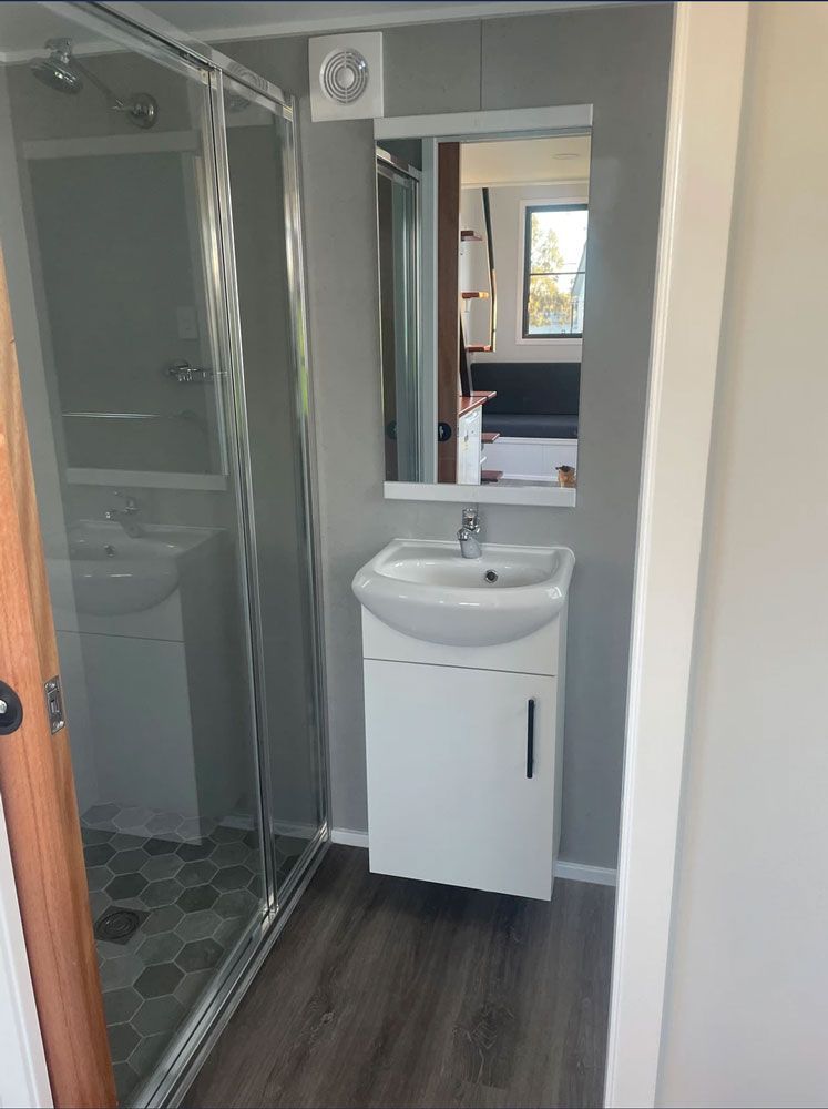 A Bathroom With a Sink and Shower — Highlands Tiny Homes In Braemar, NSW