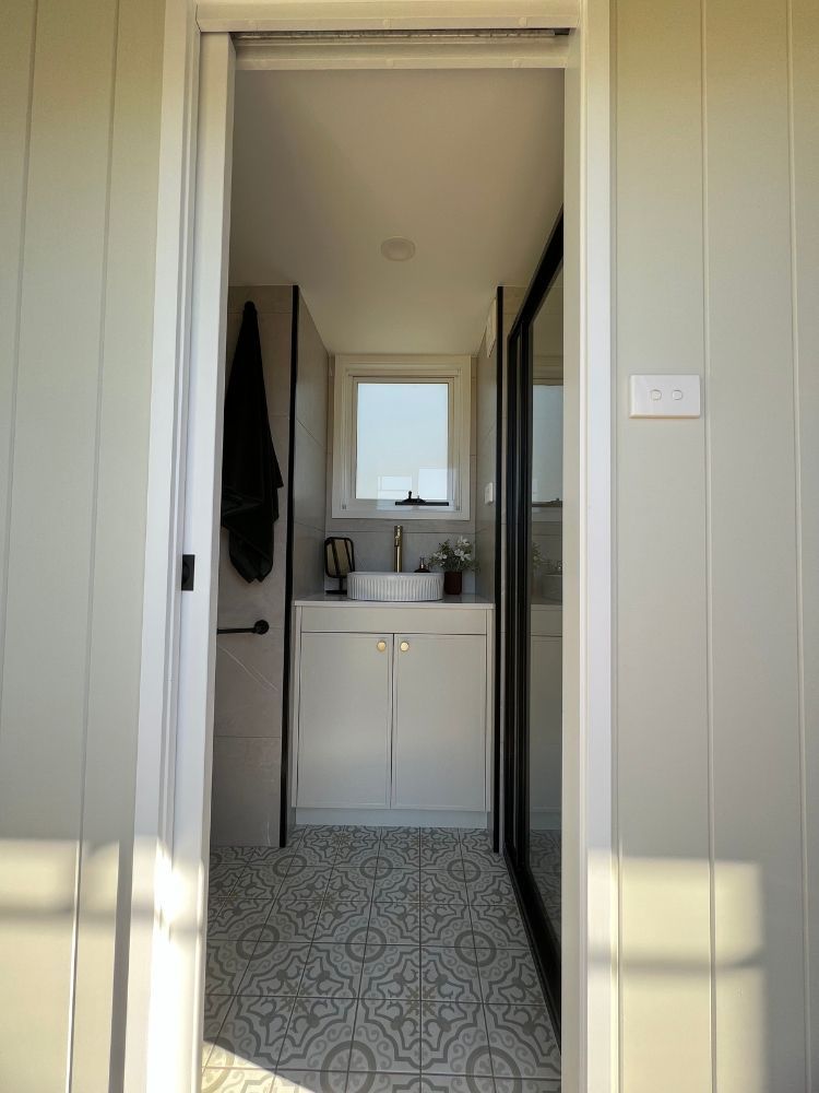 A Bathroom With a Sink and a Window — Highlands Tiny Homes In Braemar, NSW