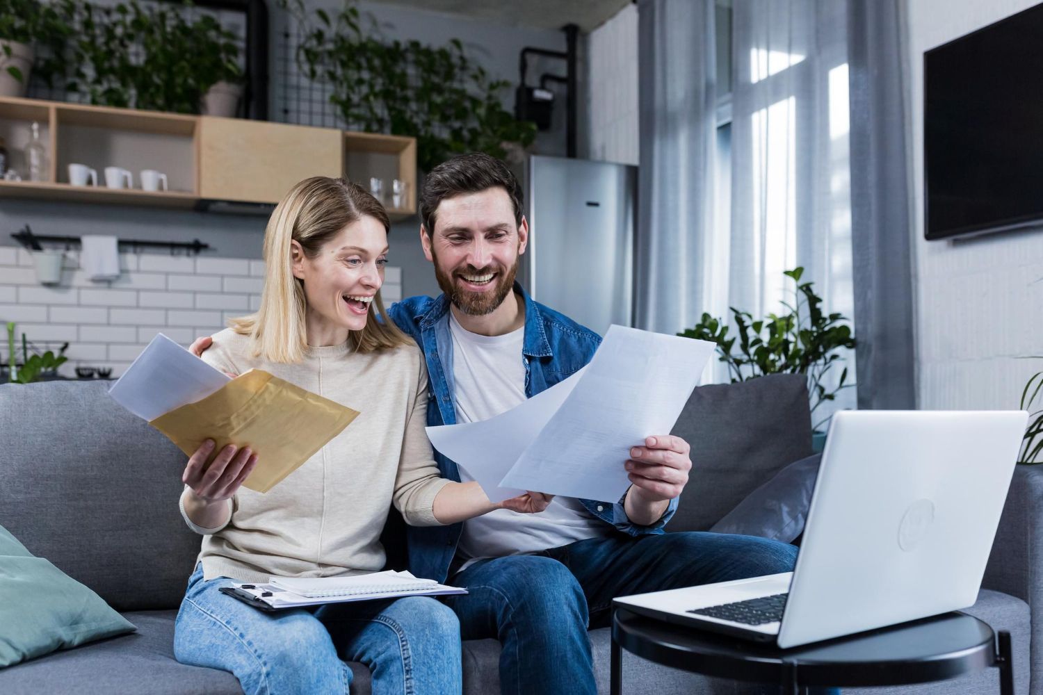 Financial advisor explaining documents to a couple at a table.