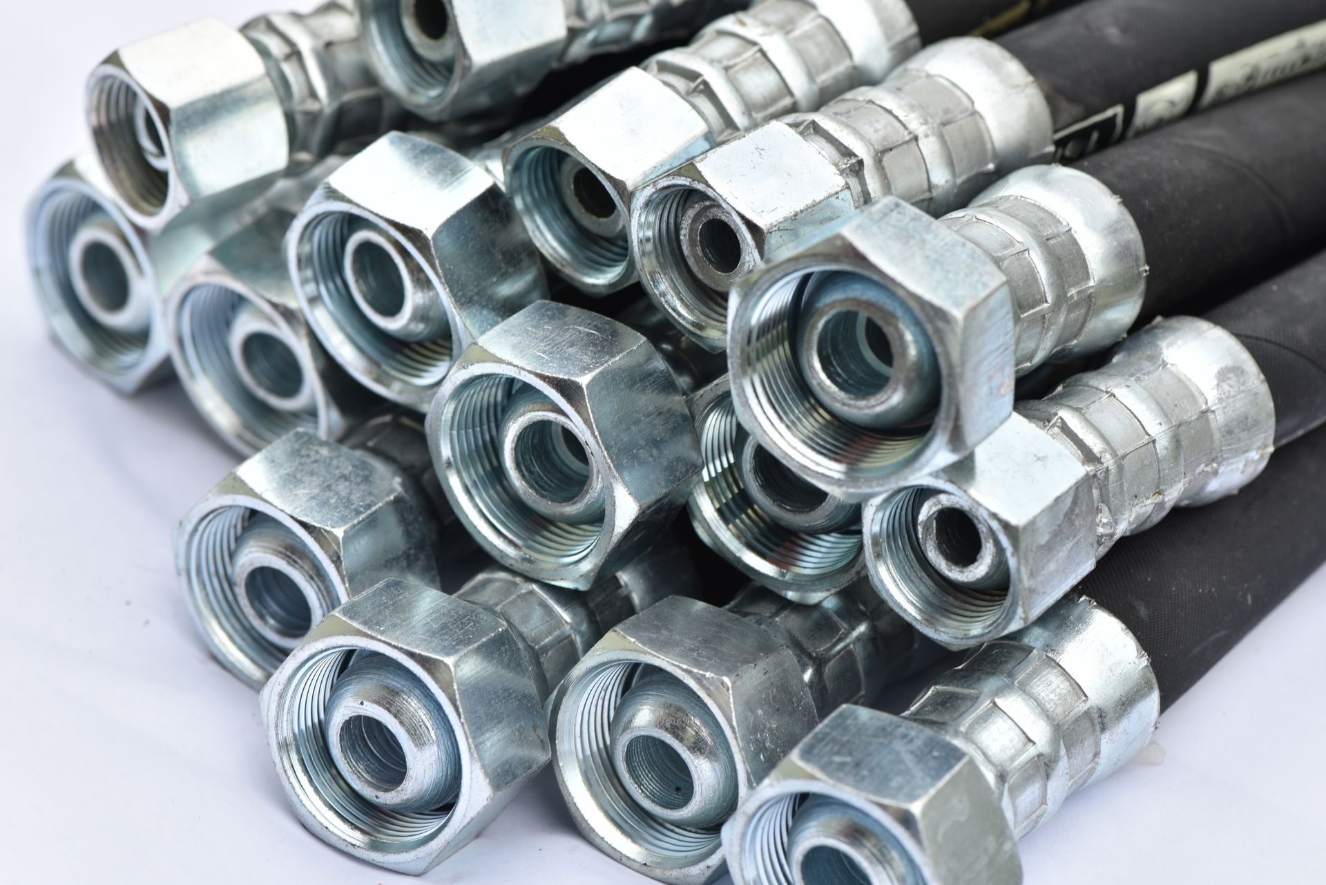 Close-up of hydraulic hoses on a white background
