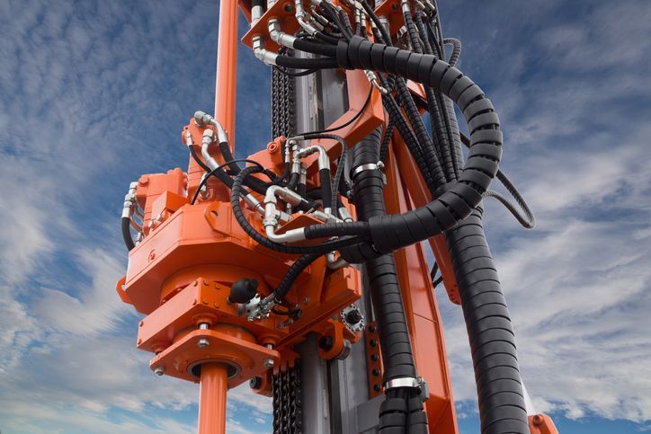 A close up of a pressure gauge on a pipe.