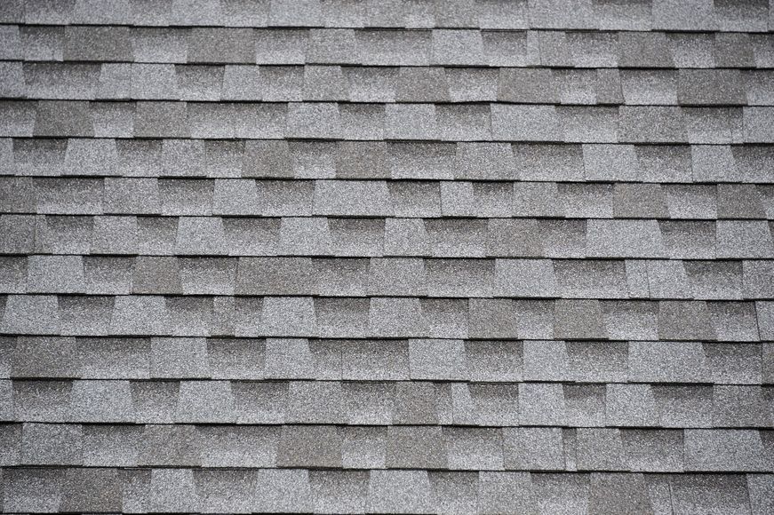 A close up of a roof with shingles on it.