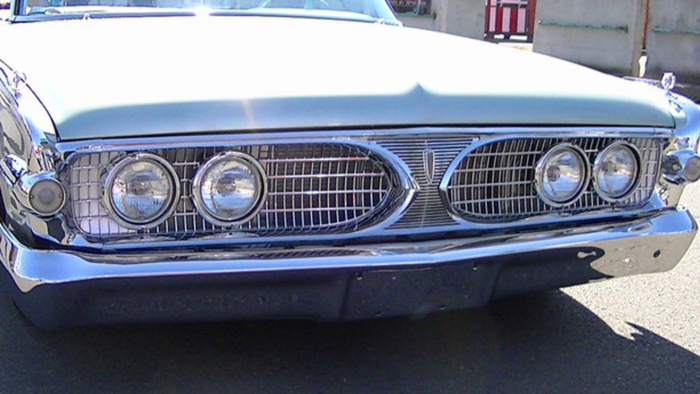 A close up of the front of an old car