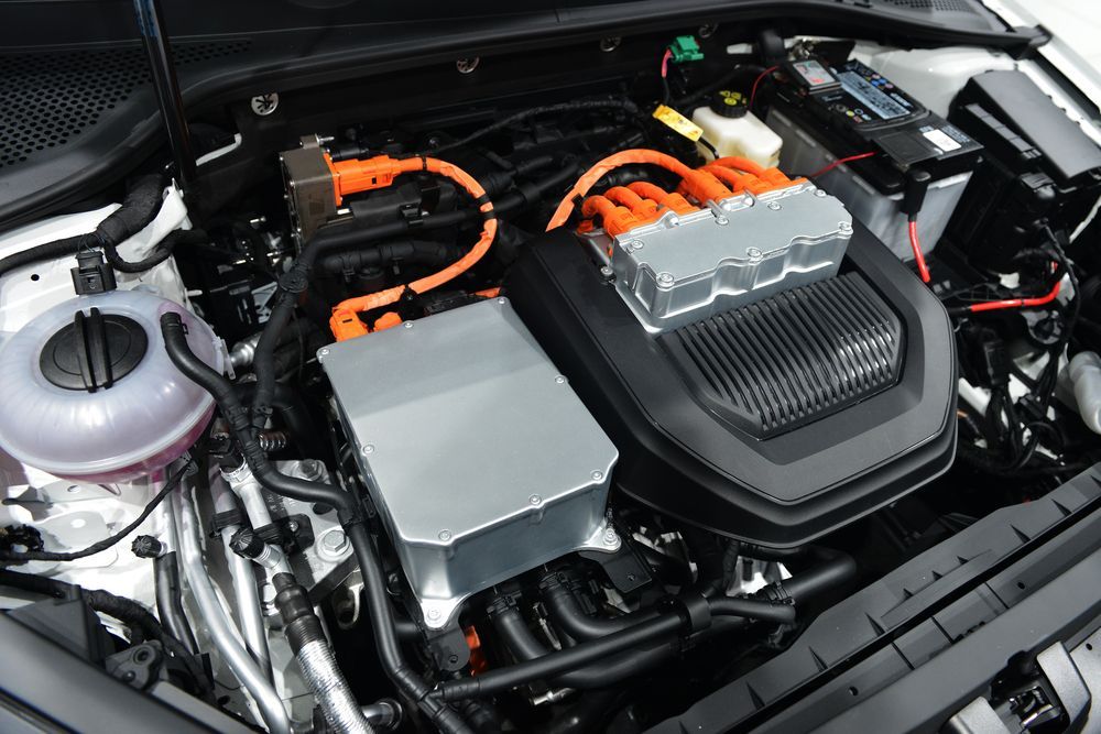 Car Engine Bay With Orange High-voltage Cables and a Large Black Cover — Van Diemen's Automotive & Electrical Repairs In Bellerive, TAS