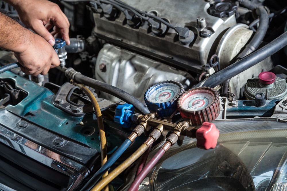 Mechanic Connecting Gauges to an Engine in a Car Bay — Van Diemen's Automotive & Electrical Repairs In Bellerive, TAS