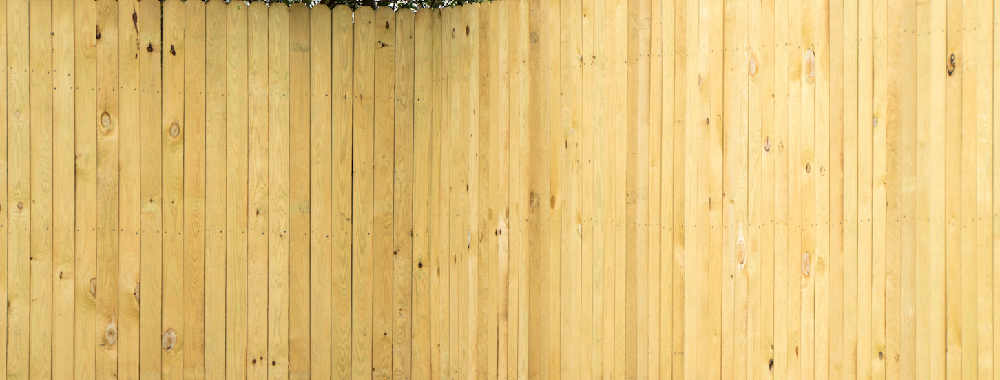 Light wood paneling background with a vertical grain and natural textures.