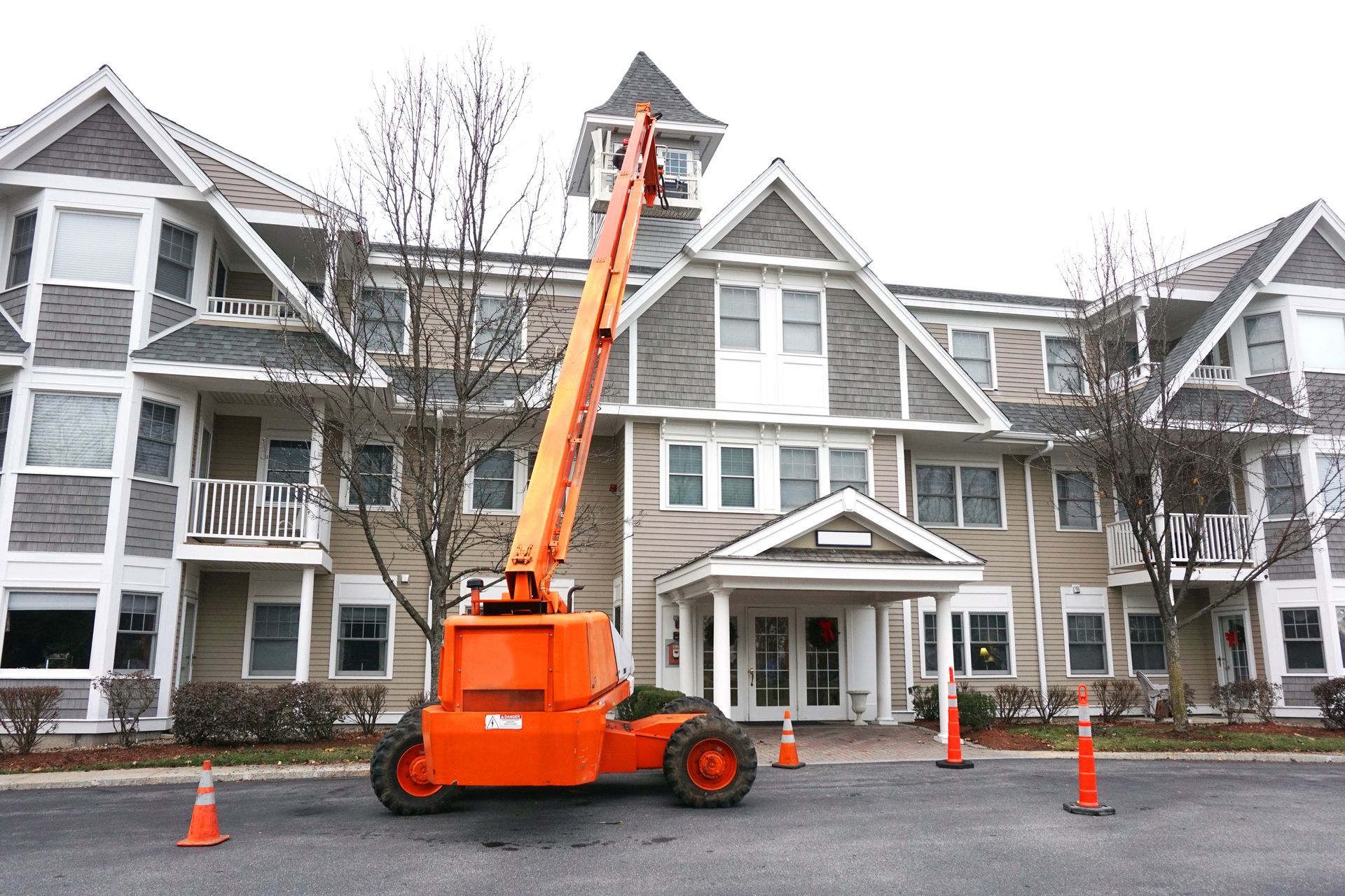 Roof repair with crane lift in a residential neighborhood. Roof repair with crane lift in a residential neighborhood.