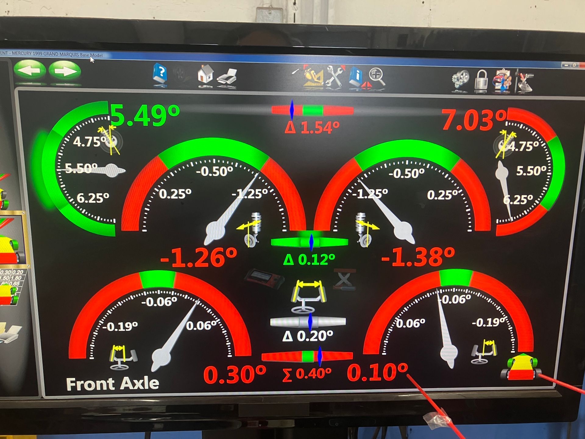 Alignment machine display showing vehicle measurements, green and red gauges. | Broadway Auto Service