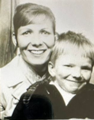 black and white photo of a mother and son. 