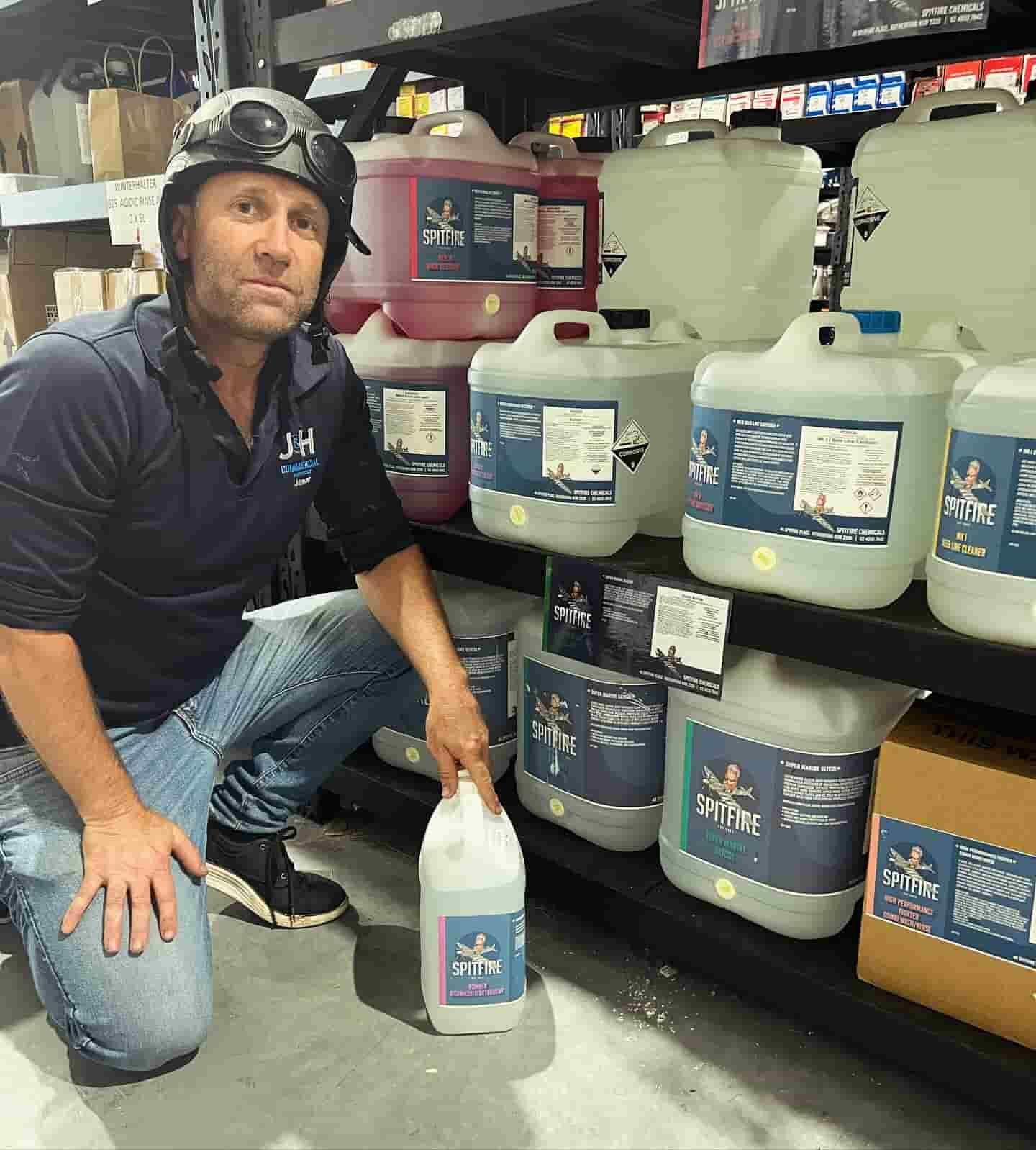 Man Holding A Liquid Cleaner — Spitfire Chemicals Pty Ltd in Rutherford, NSW