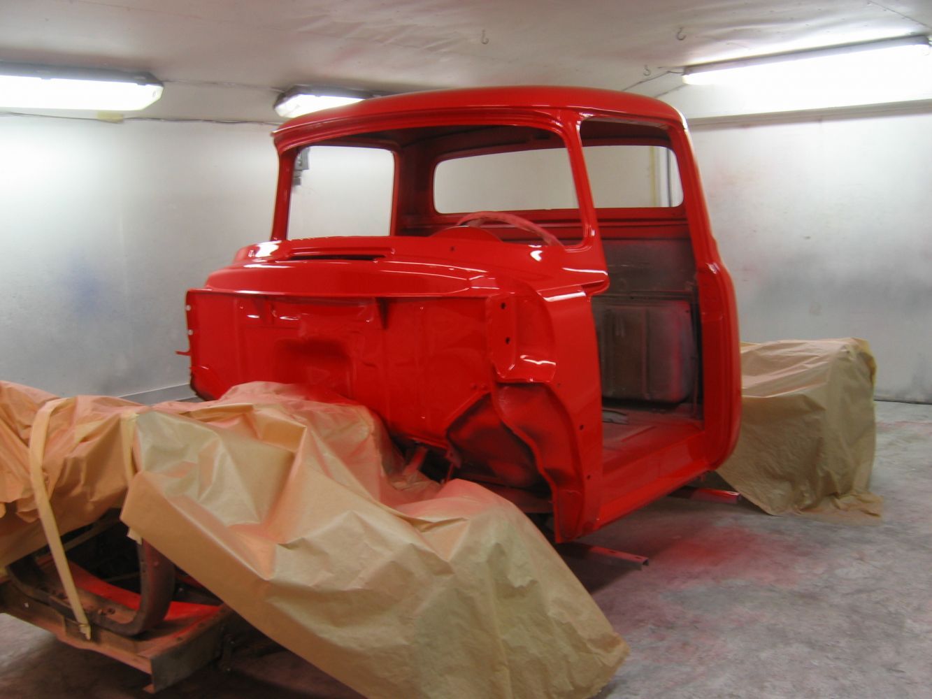 Truck being painted by Contractors Equipment & Service Corp auto paint shop 