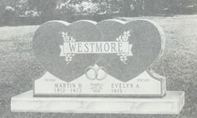 Gravestone with two heart-shaped sections joined at the base, with the family name 