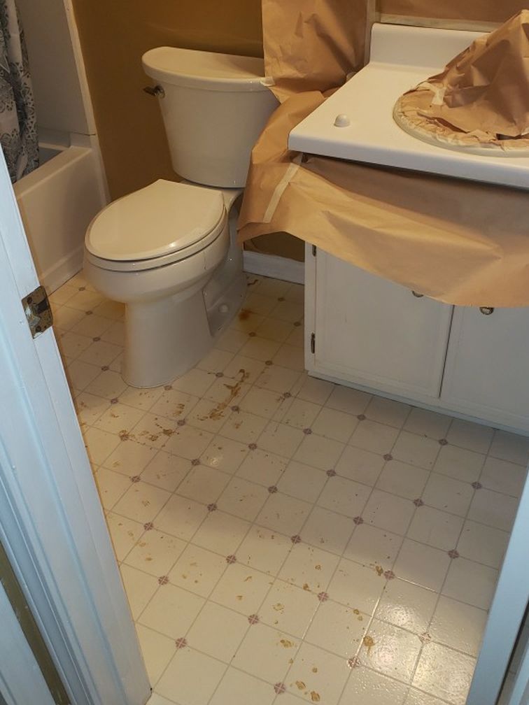 A bathroom with a toilet a sink and a bathtub